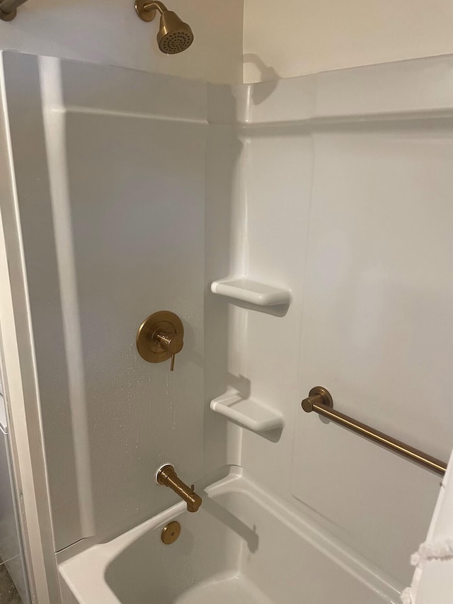 bathroom with shower / bathing tub combination