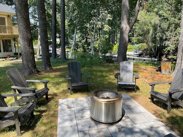 view of patio / terrace with a fire pit