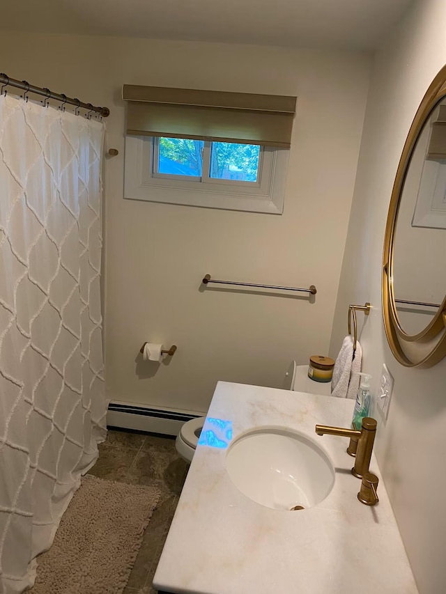 full bath featuring a baseboard heating unit, a shower with shower curtain, vanity, and toilet