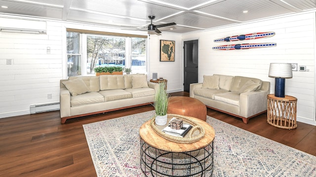 living area with dark wood-style floors, coffered ceiling, a wall mounted air conditioner, and baseboard heating