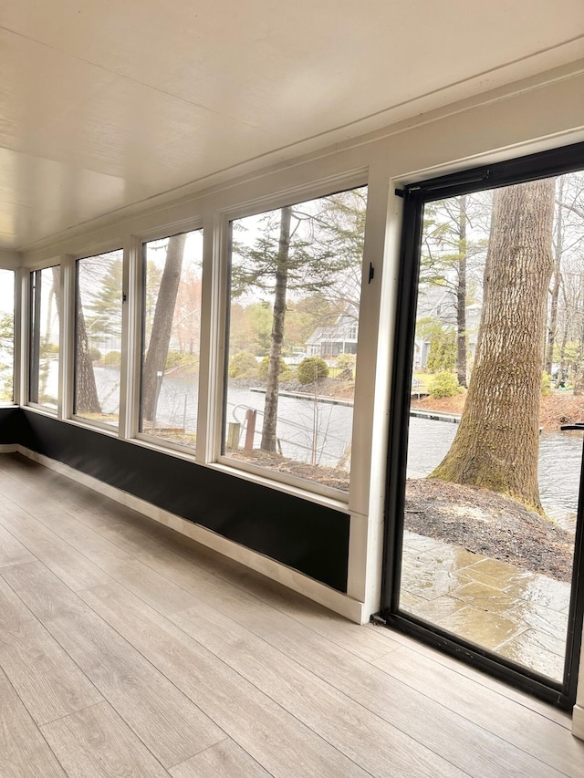 7 Birch Dr, Raymond, ME 04071 - unfurnished sunroom with hardwood / wood-style floors and a water view