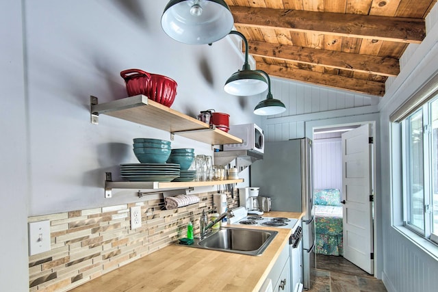 kitchen with wooden ceiling, white microwave, vaulted ceiling with beams, open shelves, and a sink