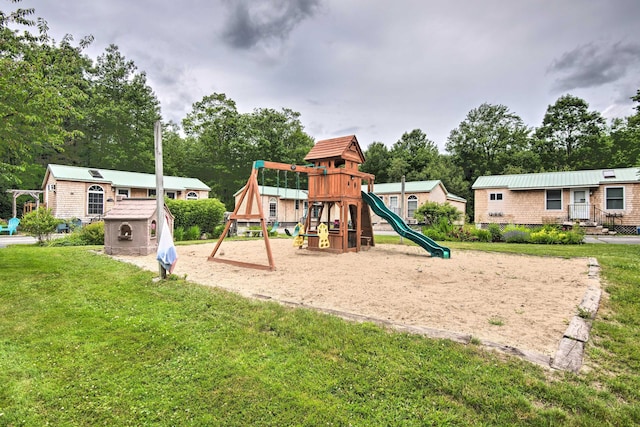 community jungle gym featuring a yard and an outdoor structure