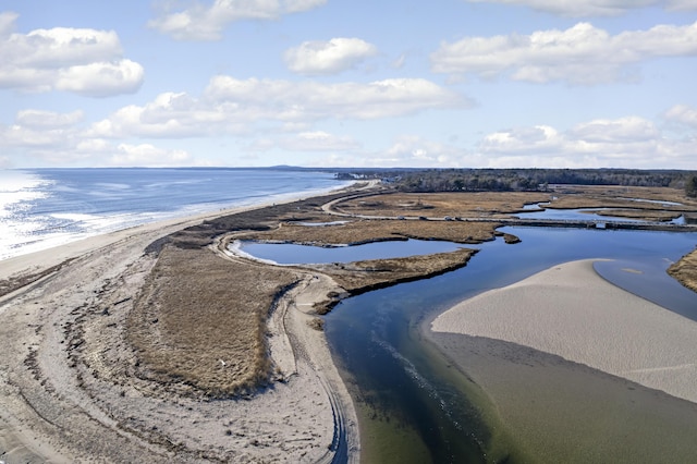 bird's eye view featuring a water view and a beach view