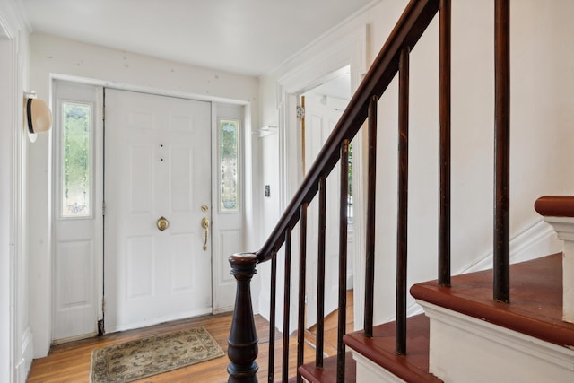 entryway with stairway and light wood-type flooring