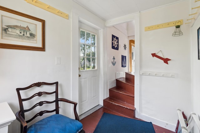 doorway featuring stairway and wood finished floors