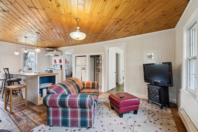 living area with a baseboard radiator, wood-type flooring, and wood ceiling