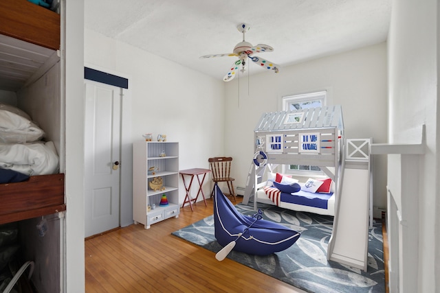 bedroom featuring a ceiling fan and hardwood / wood-style floors