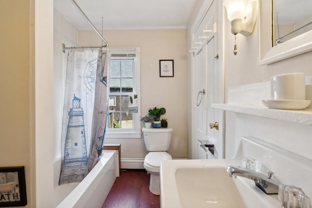 bathroom featuring shower / bath combo with shower curtain, toilet, a sink, wood finished floors, and a baseboard radiator