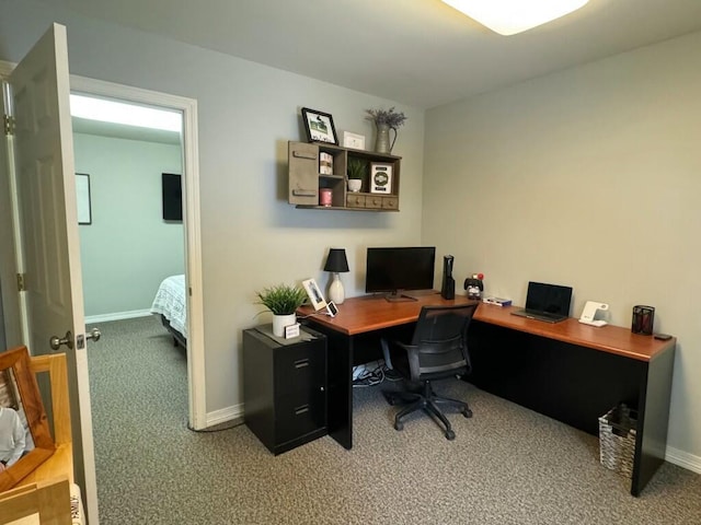 carpeted office with baseboards