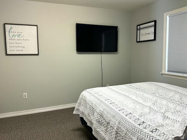 carpeted bedroom with baseboards