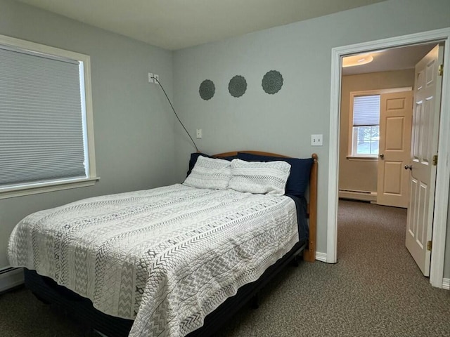 carpeted bedroom featuring a baseboard radiator