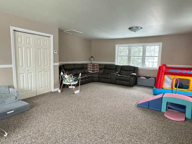 rec room featuring carpet and visible vents