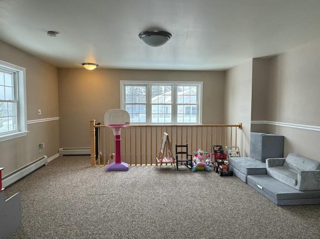 rec room featuring carpet flooring and baseboard heating