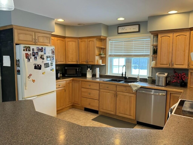 kitchen with open shelves, dark countertops, freestanding refrigerator, a sink, and dishwasher