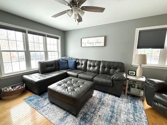 living area featuring ceiling fan and hardwood / wood-style flooring