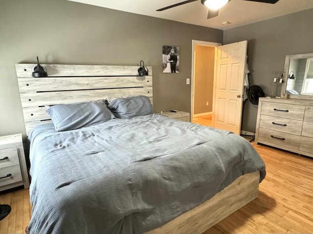 bedroom with light wood-style floors and ceiling fan