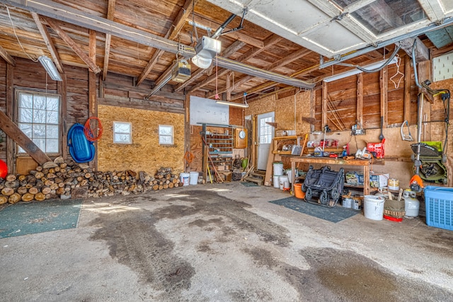 garage featuring a workshop area and a garage door opener