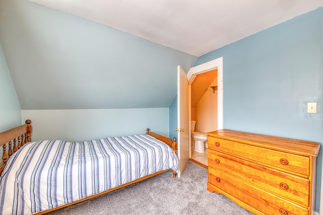 carpeted bedroom with lofted ceiling