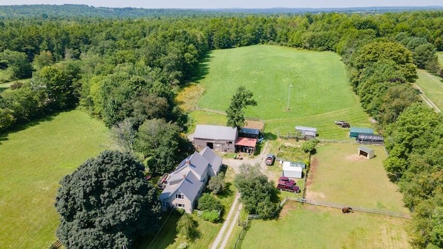 drone / aerial view with a forest view and a rural view