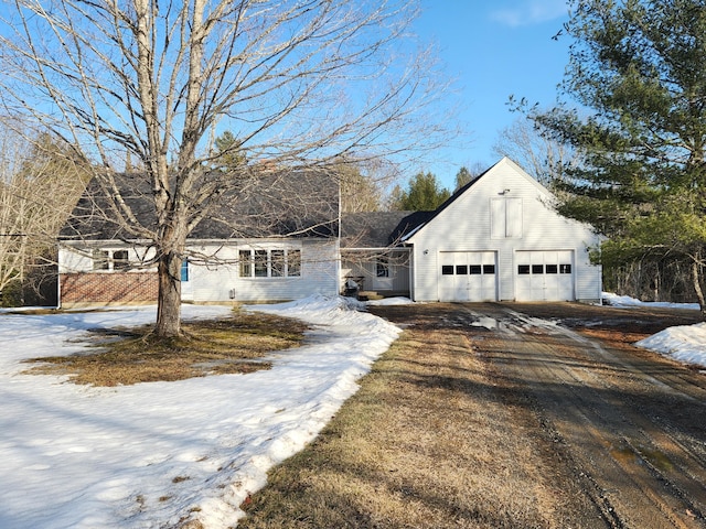 view of front of property featuring an attached garage and driveway