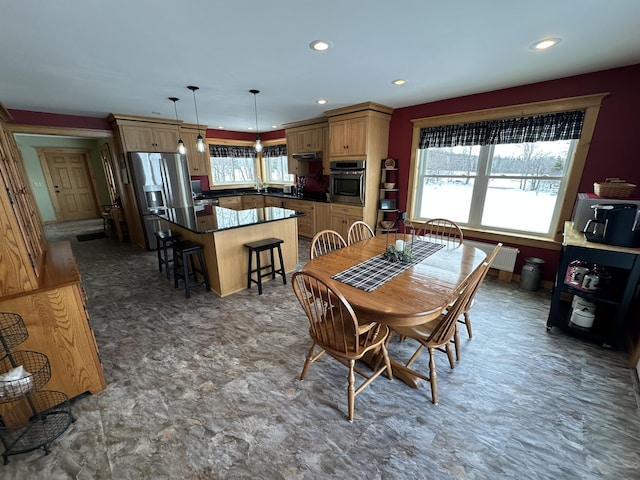 dining room with recessed lighting