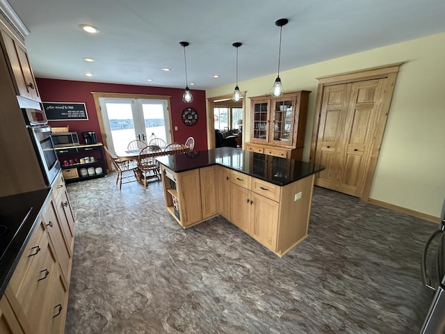 kitchen with dark countertops, a center island, stainless steel appliances, open shelves, and recessed lighting