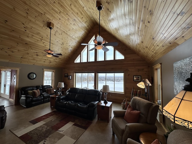 living room featuring a ceiling fan, wooden ceiling, a water view, wood walls, and high vaulted ceiling