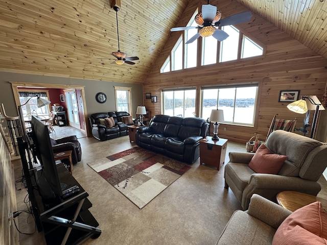 living room featuring wood ceiling, wooden walls, high vaulted ceiling, and ceiling fan