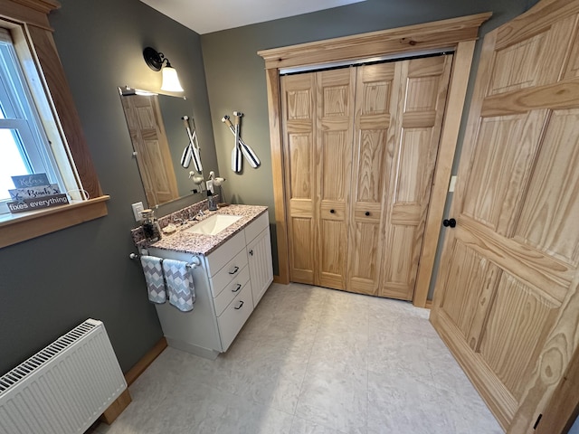 bathroom featuring vanity and radiator heating unit