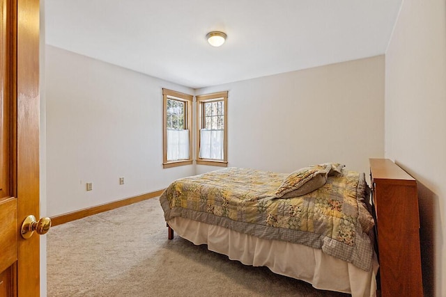 bedroom featuring carpet floors and baseboards