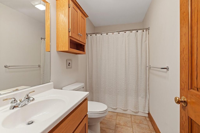 full bathroom featuring vanity, toilet, and baseboards