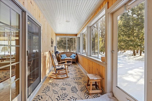 sunroom featuring wooden ceiling