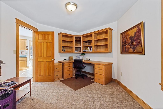 office featuring baseboards and carpet flooring