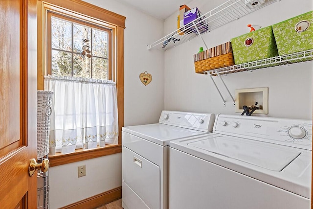 laundry room with laundry area, separate washer and dryer, and baseboards