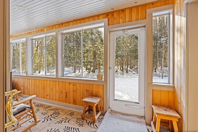 sunroom with wood ceiling and a wealth of natural light