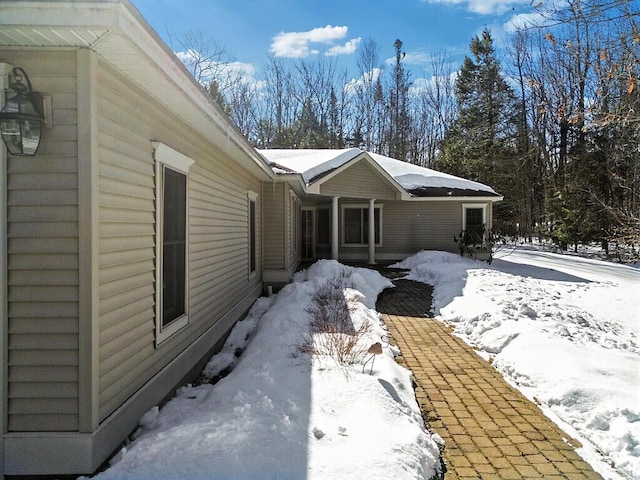 view of snow covered property