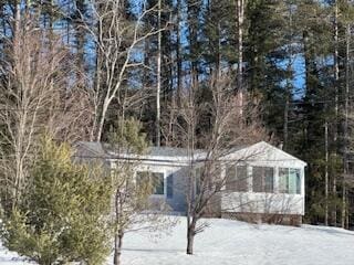 exterior space featuring a forest view