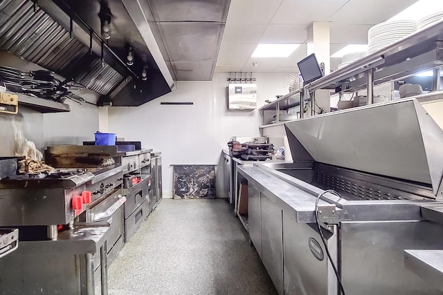 kitchen featuring a paneled ceiling and open shelves