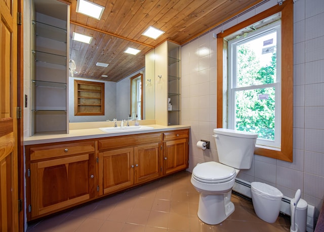 bathroom featuring toilet, wood ceiling, tile patterned floors, a baseboard heating unit, and tile walls