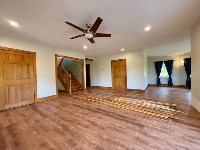 547 Mariaville Rd, Ellsworth, ME 04605 - unfurnished living room with ceiling fan, stairway, wood finished floors, and recessed lighting