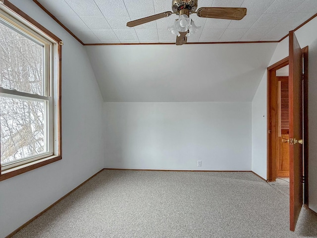 bonus room with carpet floors, vaulted ceiling, and baseboards