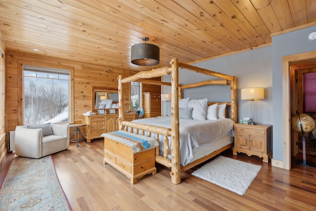 bedroom with wooden ceiling and wood finished floors