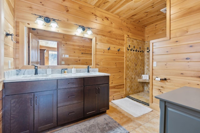 full bath with wooden ceiling, wooden walls, a sink, and tiled shower