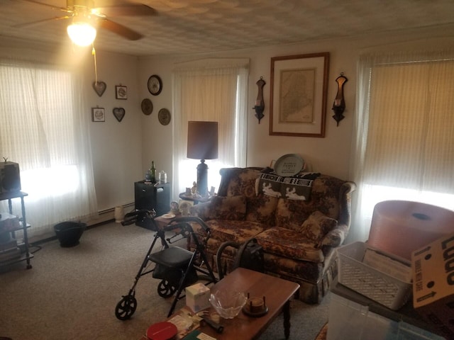 living area featuring a ceiling fan and carpet flooring