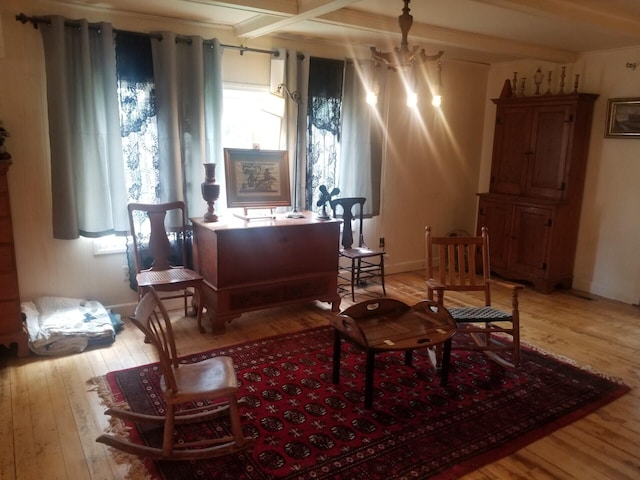 46 Collins St, Caribou, ME 04736 - sitting room featuring light wood-type flooring, a notable chandelier, and baseboards