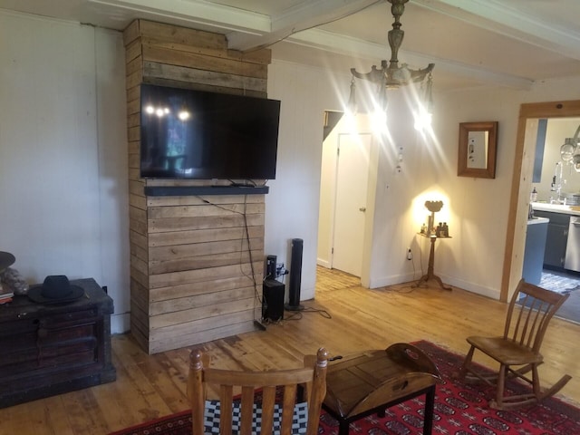 46 Collins St, Caribou, ME 04736 - living area featuring beam ceiling, light wood-style flooring, and baseboards