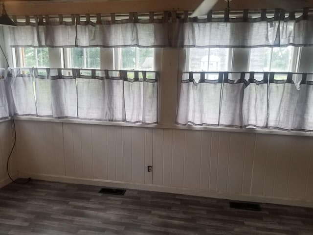 46 Collins St, Caribou, ME 04736 - unfurnished room featuring wood walls, dark wood-style flooring, and visible vents