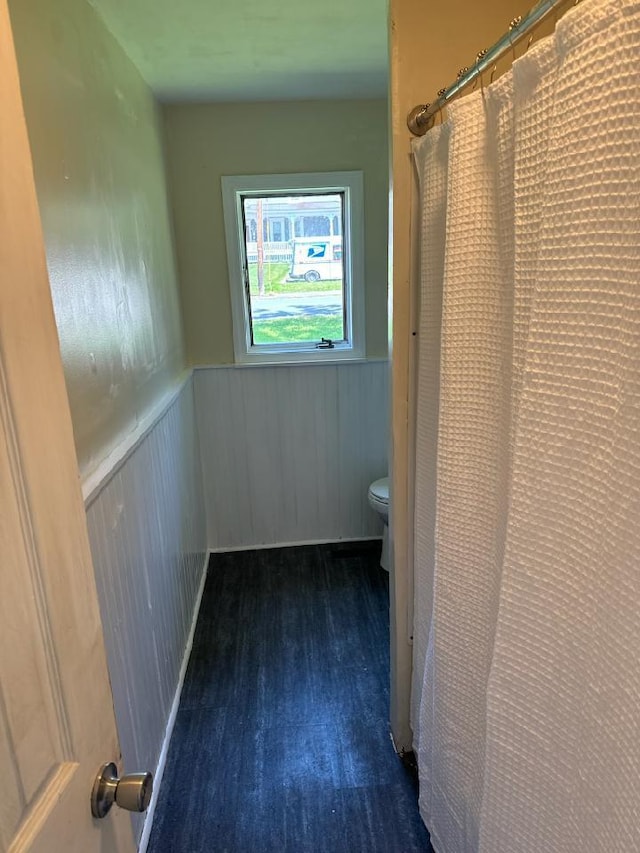 46 Collins St, Caribou, ME 04736 - full bath featuring a shower with shower curtain, a wainscoted wall, toilet, and wood finished floors