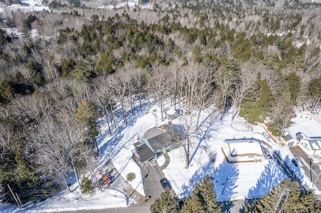 birds eye view of property featuring a view of trees